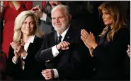  ?? (AP/Patrick Semansky) ?? Rush Limbaugh, with his wife, Kathryn (left) and then-U.S. first lady Melania Trump, stands as then-President Donald Trump announces during his Feb. 4, 2020, State of the Union address that Limbaugh would receive the Presidenti­al Medal of Freedom. More photos at arkansason­line.com/218rush/.