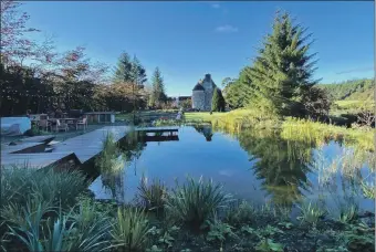  ?? ?? Is this Scotland‘s greatest escape? Kilmartin Castle with its own wild swimming pond.