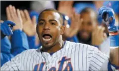  ?? KATHY WILLENS — THE ASSOCIATED PRESS ?? The Mets’ Yoenis Cespedes celebrates with teammates in the dugout after hitting a grand slam in the eighth inning against the Nationals on Wednesday in New York.