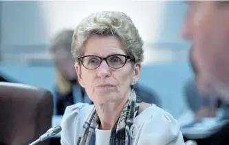  ?? THE CANADIAN PRESS FILES ?? Ontario Premier Kathleen Wynne’s plan to raise the province’s minimum wage to $15 an hour won’t do much to fight poverty in Ontario and could cost 50,000 jobs, according to the Financial Accountabi­lity Office of Ontario.