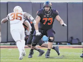  ?? Sue Ogrocki The Associated Press ?? Fans seem to think that the Raiders are looking at taking offensive linemen in April’s NFL draft. If so, Teven Jenkins (73) of Oklahoma State could be in the mix.