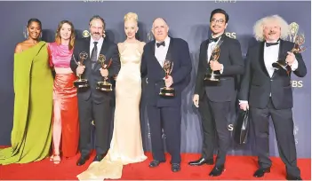  ?? — AFP photo ?? (From left) Moses Ingram, Marielle Heller, Scott Frank, Anya Taylor-Joy, William Horberg, Mick Aniceto, and Marcus Loges, winners of the Outstandin­g Limited Or Anthology Series award for ‘The Queen’s Gambit,’ pose in the press room during the 73rd Primetime Emmy Awards at LA LIVE in Los Angeles, California.