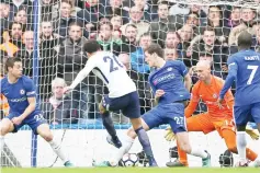  ?? - AFP photo ?? Tottenham Hotspur’s English midfielder Dele Alli (C) shoots to score their third goal during the English Premier League football match between Chelsea and Tottenham Hotspur at Stamford Bridge in London on April 1, 2018.