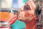  ?? REUTERS ?? Stefanos Tsitsipas kisses the Monte Carlo Masters trophy after beating Casper Ruud in the final on Sunday.