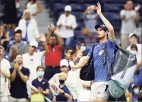  ?? Elsa / Getty Images ?? Andy Murray waves to the crowd after losing to Stefanos Tsitsipas during their men’s singles first-round match at the US Open on Monday.