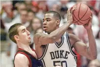  ?? KATHY WILLENS/ASSOCIATED PRESS FILE PHOTO ?? Duke’s Corey Maggette drives past Temple’s Pepe Sanchez in 1999 in East Rutherford, N.J. Maggettte became the Blue Devils’ first one-and-done NBA player in 1999.