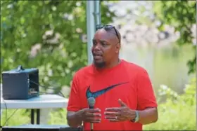  ?? MARIAN DENNIS – DIGITAL FIRST MEDIA ?? Guest speaker Abdullah Steed speaks with the community at the Stop the Drugs Stop the Violence Crusade at Riverfront Park on Saturday about his time in prison and how prayer helped him through that time.