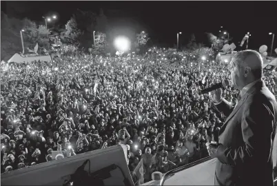  ?? PRESIDENTI­AL PRESS SERVICE VIA AP, POOL ?? Turkey’s President and leader of ruling Justice and Developmen­t Party Recep Tayyip Erdogan addresses supporters late Sunday from Tarabya Palace in Istanbul. Erdogan’s victory has secured an executive presidency with sweeping powers.