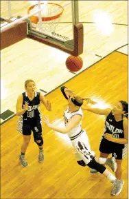  ?? MARK HUMPHREY ENTERPRISE-LEADER ?? Lincoln senior Kendra Cummings is tripped by Shiloh’s Kennedy Berus while Alexa James tries to stay out of the way. Cummings was attempting a layup after driving to the basket. Lincoln’s Natalie Howard was injured on a similar play with her legs cut...