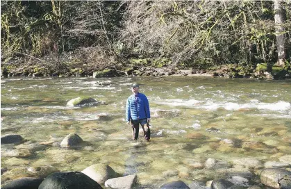  ??  ?? Conservati­onist Mark Angelo stands in the Seymour River, one of British Columbia’s most-endangered waterways that could benefit from the programs being proposed by a group of conservati­on and recreation groups in the province.