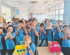  ??  ?? Currajong State School students get ready to launch their pinball machines.