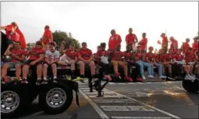  ??  ?? Football players riding down the street in the Fleetwood Homecoming Parade on Oct. 6.