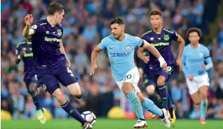  ?? AFP ?? Everton’s English defender Michael Keane (left) vies for the ball with Manchester City’s Sergio Aguero during a Premier League match. —