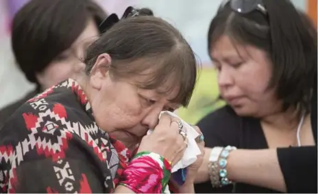  ?? JONATHAN HAYWARD/THE CANADIAN PRESS ?? Bella Bresse wipes away a tear as she speaks about her murdered daughter, Evangeline Kris Bresse, at the national inquiry being held in Whitehorse.