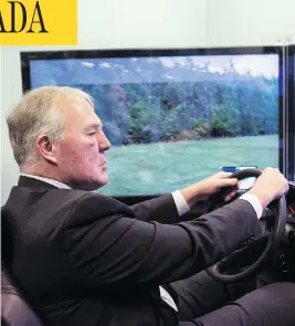  ?? CHRIS YOUNG / THE CANADIAN PRESS FILES ?? Bill Blair, the Liberals’ point man on legalizing marijuana, sits in a simulator that mimics the effects of driving under the influence of pot, earlier this year in Toronto.