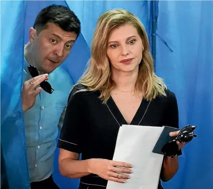  ?? AP ?? Ukrainian President Volodymyr Zelenskyy, left, and his wife, Olena Zelenska, leave a booth at a polling station during a parliament­ary election in Kyiv in July 2019. Zelenska says she has not seen her husband since Russia invaded Ukraine on February 24.