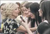  ?? Octav Ganea Pool Photo ?? FIRST LADY JILL BIDEN, left, meets Ukrainian refugees in Bucharest, Romania. “We stand with you,” Biden told the women and children she met.