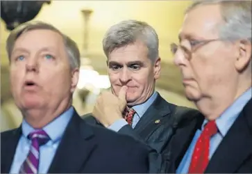  ?? Alex Brandon Associated Press ?? SEN. LINDSEY GRAHAM, left, with Sens. Bill Cassidy, center, and Mitch McConnell, on Capitol Hill.