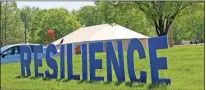  ?? John Bailey ?? A sign in front of Redmond Regional Medical Center that reads “Resilience” stands in front of a surge tent donated by the Georgia Emergency Management and Homeland Security Agency.