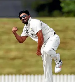  ?? PHOTOSPORT ?? Ajaz Patel didn’t start bowling spin until he was 21. Now he’s in the Black Caps.