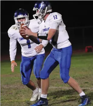  ?? Photos by Ernest A. Brown ?? Cumberland quarterbac­k Joe Leonard (12), running back Michael King (1) and the Clippers secured a 20-14 Division I road win over Central Friday night at Conley Stadium.