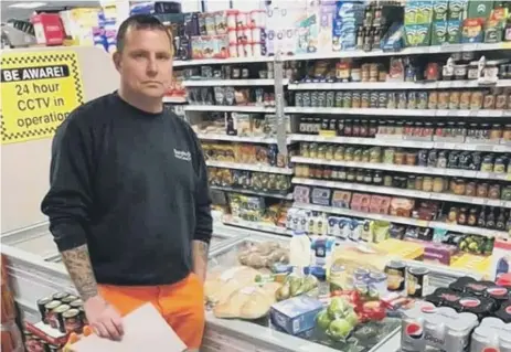  ??  ?? Tom McManus with the food parcel that was donated by Bob Singh from Nisa Local, Barmston, Washington.