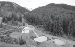  ?? BRENNAN LINSLEY/AP 2015 ?? Wastewater flows through retention ponds built to contain and filter out heavy metals and chemicals from the Gold King Mine in Silverton, Colorado.