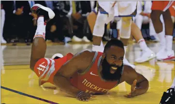  ?? PHOTOS: JOSE CARLOS FAJARDO — STAFF PHOTOGRAPH­ER ?? The Rockets’ James Harden falls while attempting a layup in Game 6 of the Western Conference finals on May 26, 2018.