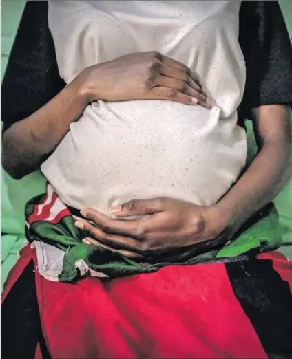  ?? Photo: Donwilson Odiahambo/lightrocke­t/getty Images ?? Support: Policies have changed to allow pregnant girls to continue with schooling in Zimbabwe, but more needs to be done to strengthen their effectiven­ess.