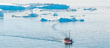  ?? 123rf/maridav and 123rf/Steven Prorak ?? Mountains in the sea: Above: Icebergs from melting glacier outside Ilulissat harbour can create tsunamis when they crack apart. Below, a view of Ilulissat, where the summer and spring lasts for only four months. /