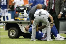  ?? SETH WENIG — THE ASSOCIATED PRESS FILE ?? In this Sunday file photo, New York Giants wide receiver Odell Beckham is helped off the ground and onto a cart after an injury in the second half of an NFL football game against the Los Angeles Chargers in East Rutherford, N.J.