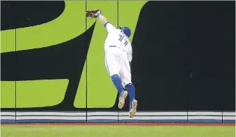  ?? TOM SZCZERBOWS­KI/GETTY IMAGES ?? Kevin Pillar’s inning-ending diving catch on a drive by Cleveland’s Jose Ramirez on Monday night prevented an extra-base hit and likely saved the Toronto Blue Jays a pair of runs.