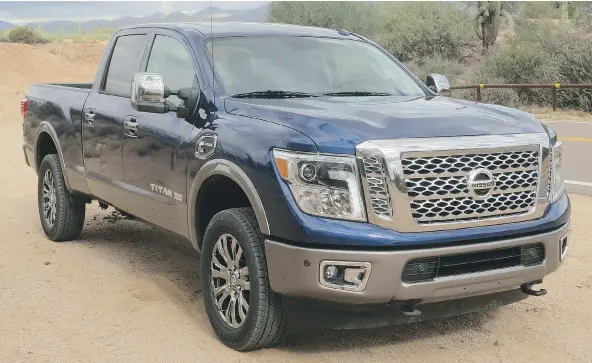  ?? PHOTOS: LESLEY WIMBUSH/DRIVING ?? To accommodat­e the big Cummins diesel V8, Nissan’s 2016 Titan XD features a longer, higher nose, with angry, T-shaped LED driving lights.