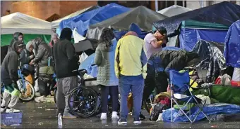  ?? CHRIS CHRISTO — BOSTON HERALD, FILE ?? New rules take effect this week that Mayor Michelle Wu says will help the city provide services to homeless residents living in the Mass and Cass area, and allow police to clear tents there.