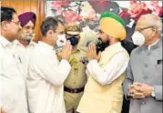  ?? HT PHOTO ?? Congress MP Rahul Gandhi greets newly appointed Punjab chief minister Charanjit Singh Channi, during the swearing-in ceremony in Chandigarh on Monday.