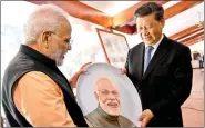  ?? IANS ?? Prime Minister Narendra Modi and Chinese President Xi Jinping exchange gifts on the 2nd day of an Informal Summit, in Tamil Nadu’s Mahabalipu­ram on Saturday.