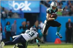  ?? JASON E. MICZEK — THE ASSOCIATED PRESS ?? Former Stanford running back Christian McCaffrey, right, has played in 97 percent of the Carolina Panthers’ offensive plays through 11 games.