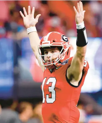  ?? TODD KIRKLAND/GETTY ?? Georgia’s Stetson Bennett reacts after a touchdown in the Peach Bowl on Saturday in Atlanta.