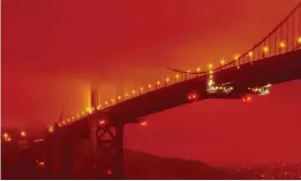  ??  ?? San Francisco’s Golden Gate bridge at 11 am PT, 9 September, 2020, amid a smoky orange hue caused by wildfires. Photograph: Frederic Larson/AP