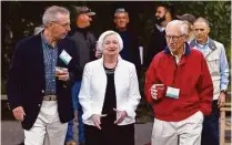  ?? Brennan Linsley / Associated Press ?? Janet Yellen strolls with Stanley Fischer, right, vice chair of the Federal Reserve System, and Bill Dudley, president of the Federal Reserve Bank of New York, before her Friday speech.