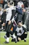  ?? RAY STUBBLEBIN­E/ REUTERS ?? Ravens kicker Billy Cundiff ( left) missed a 32- yard field goal with 11 seconds left to hand the Patriots a 23- 20 win.