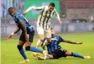  ??  ?? Cristiano Ronaldo (centre) is tackled by Arturo Vidal. Photograph: Matteo Bazzi/ EPA