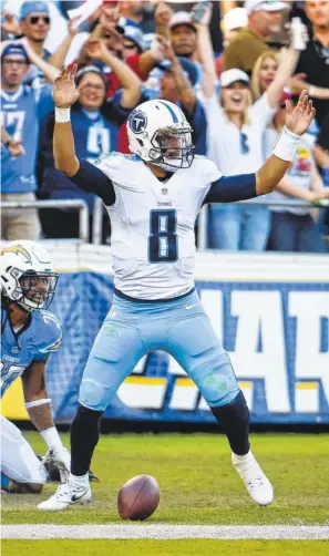  ?? ASSOCIATED PRESS FILE PHOTOS ?? Titans quarterbac­k Marcus Mariota is working with his third play caller in Tennessee since being drafted out of Oregon. “I’m glad he’s our quarterbac­k. There’s no question about it,” Titans coach Mike Mularkey said.