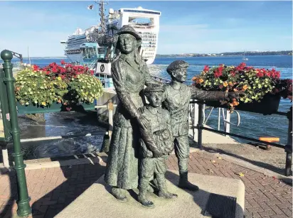  ?? PHOTOS: NEVILLE PEAT ?? Mass emigration . . . Diaspora memorial at the port of Cobh, Cork, with a modern cruise ship, Dawn Princess, leaving the port.