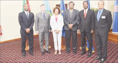  ??  ?? Minister of Public Security, Khemraj Ramjattan [third from right] flanked by facilitato­rs of the regional seminar. Chargé d’ Affaires at the US Embassy in Guyana, Terry Steers-Gonzalez [second from left], Health and Human Coordinato­r at the CARICOM...