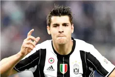  ??  ?? (FILES)This file photo taken on May 22, 2016 shows Juventus’ forward from Spain Alvaro Morata celebratin­g after scoring during the Italian Tim Cup final football match AC Milan vs Juventus on May 21, 2016 at the Olympic Stadium in Rome. Real Madrid...