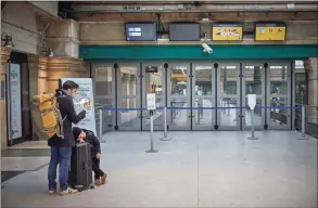  ?? Kiran Ridley / Getty Images ?? Passengers wait for the Eurostar terminal to open at Gard du Nord in Paris, France, on Friday for one of the first trains to the United Kingdom after Brexit. Friday, the first day of 2021, marked the first day of Britain’s future outside the European Union.