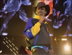  ?? PHOTO BY SCOTT ROTH/INVISION/AP ?? This June 1 file photo shows Lil Nas X performing at HOT 97 Summer Jam 2019 in East Rutherford, N.J.