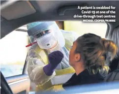  ?? MICHAEL COOPER/PA WIRE ?? A patient is swabbed for
Covid-19 at one of the drive-through test centres