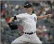  ?? SETH WENIG - THE ASSOCIATED PRESS ?? New York Yankees starting pitcher J.A. Happ throws during the first inning of a baseball game against the Baltimore Orioles at Yankee Stadium on Sunday.